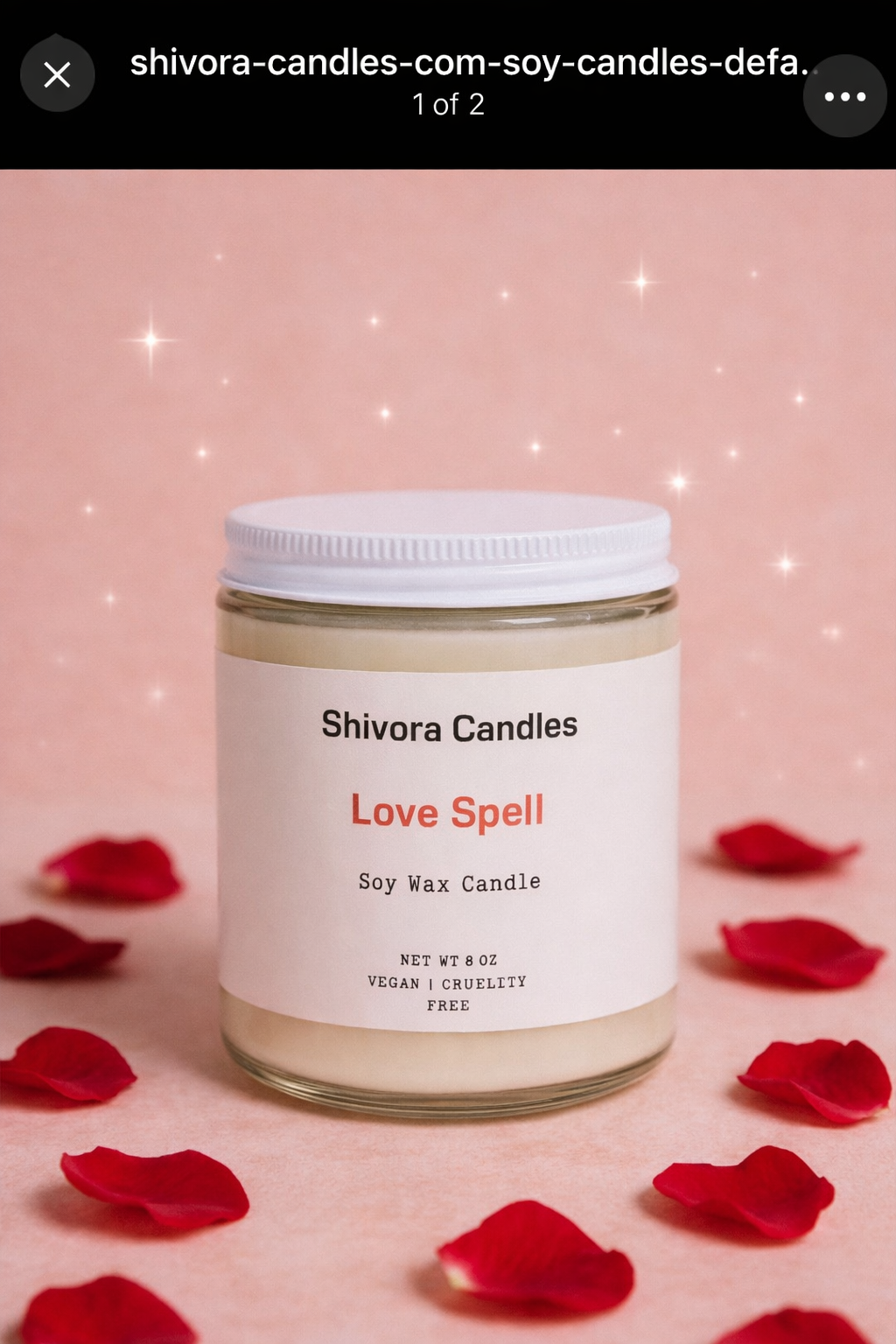 Shivora Candles Love Spell candle on a pink background with red rose petals